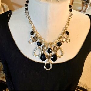 Striking light gold/black “sits in the pocket”necklace!